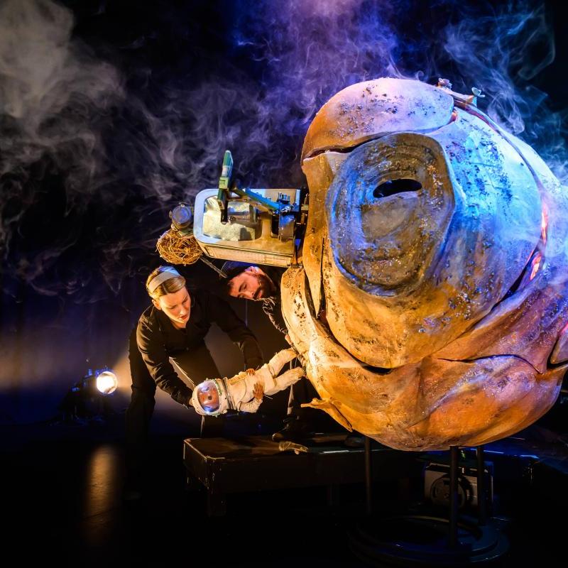 A Tiny Planet with a puppet standing on the surface upside down. 