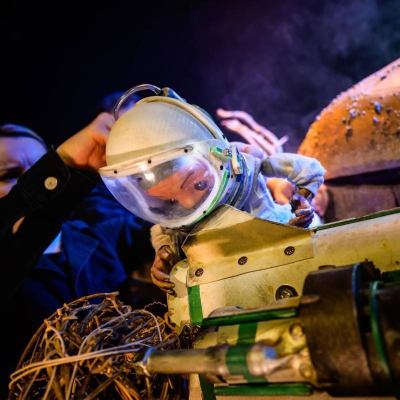 Space Person looking at their space vehicle 