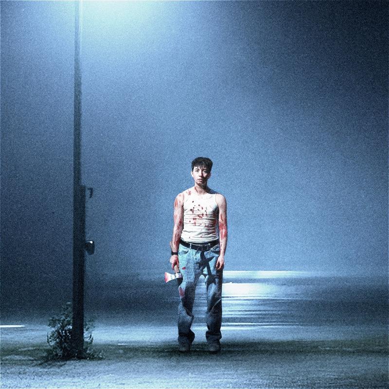 A person wearing a bloodstained vest and jeans stands in a dramatic blue lit scene. The path he stands on is visibly wet, and he is holding what appears to be an equally bloodstained axe.