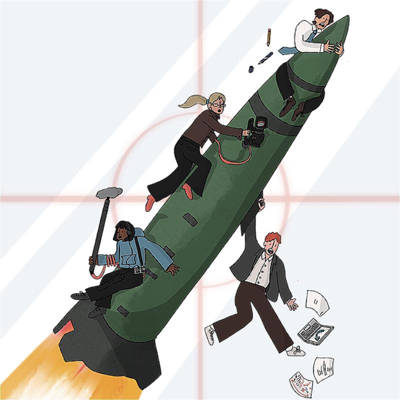 Four cartoons characters (a Black woman with black hair, a white ginger man, a white blonde woman and a white man with brown hair) are holding on to a war missile being fired up. They all have different film crew accessories and a red target circle is centered on the missile.