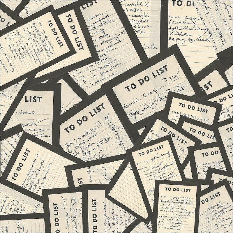 Lots of To Do Lists overlap one another on the floor. 