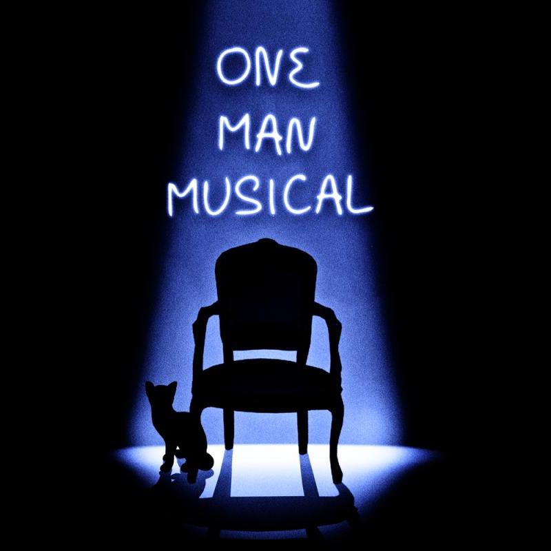 An empty chair is lit by a single spotlight. The outline of a cat can be seen at the spotlight's edge. Above the chair the show's title, One Man Musical, is written.