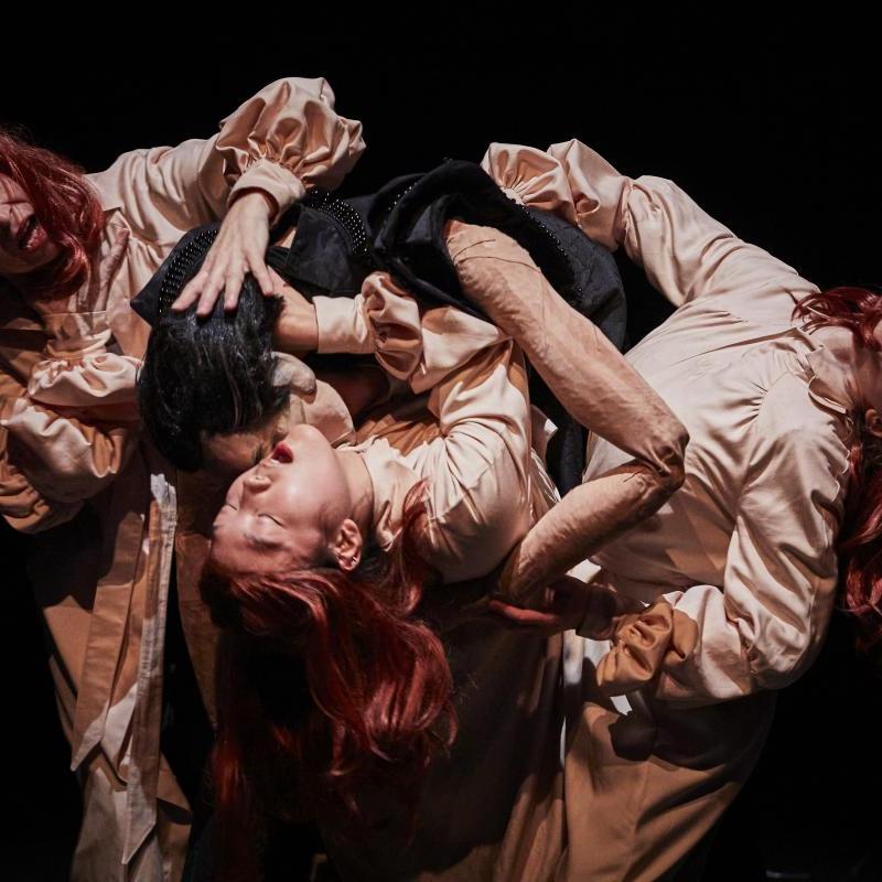 Photograph of three women and Dracula