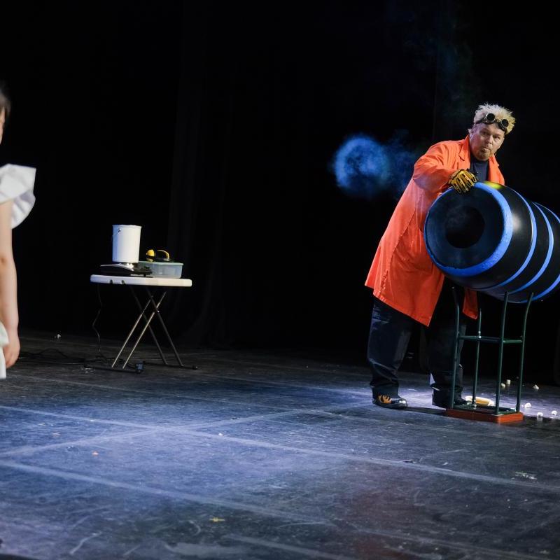 Photo showing Doktor Kaboom demonstrating a science experience with a guest participant