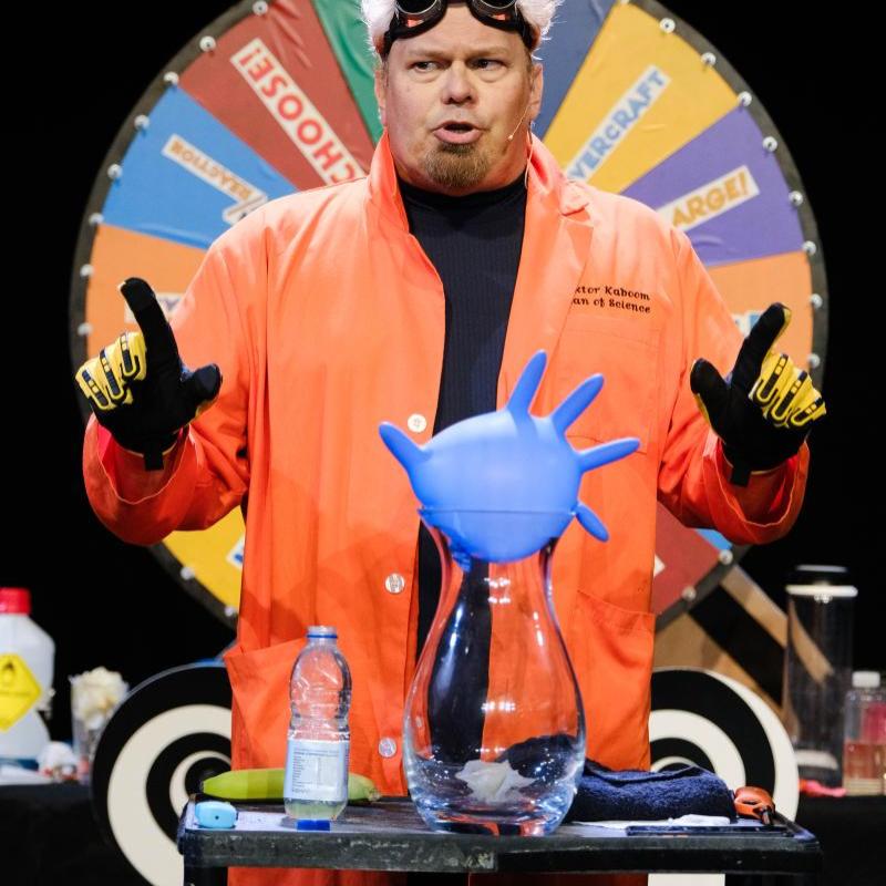 Photo of Doktor Kaboom doing a science experiment