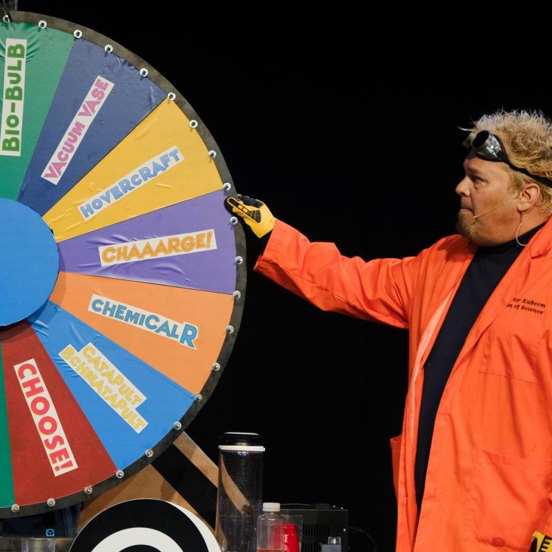 Picture of Doktor Kaboom spinning the wheel of science