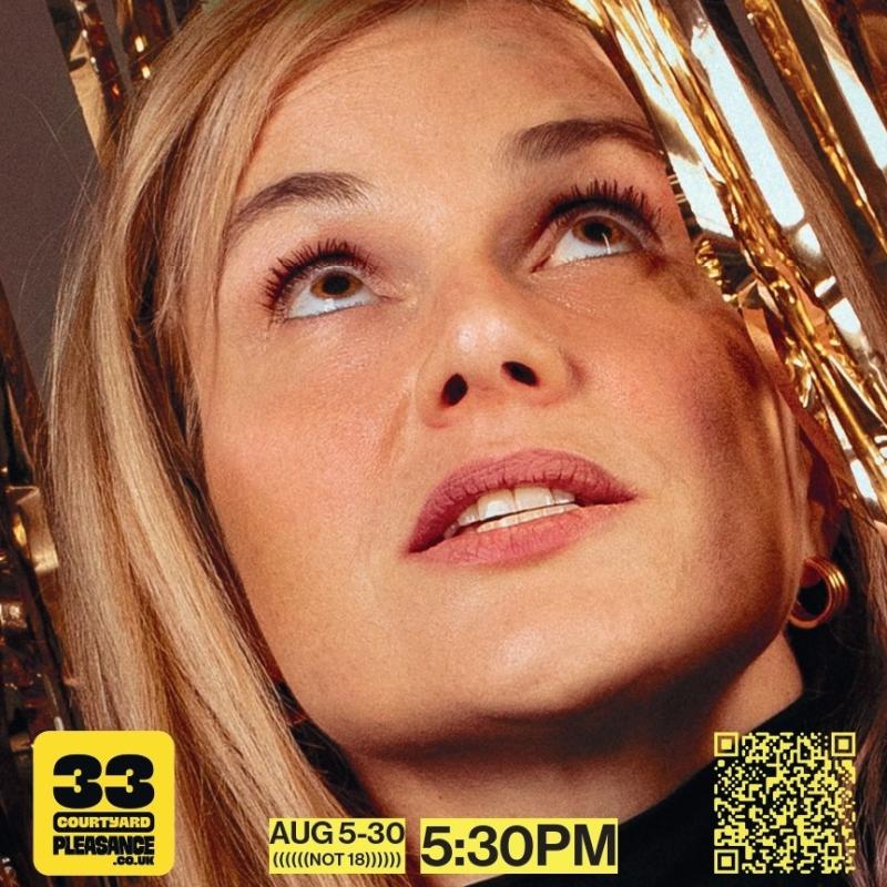 Davina, a white woman with blonde hair, looks up through gold ribbon curtains.