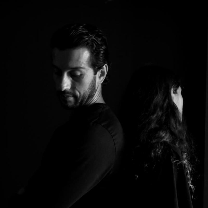 Black and white photo of a man and woman silhouetted