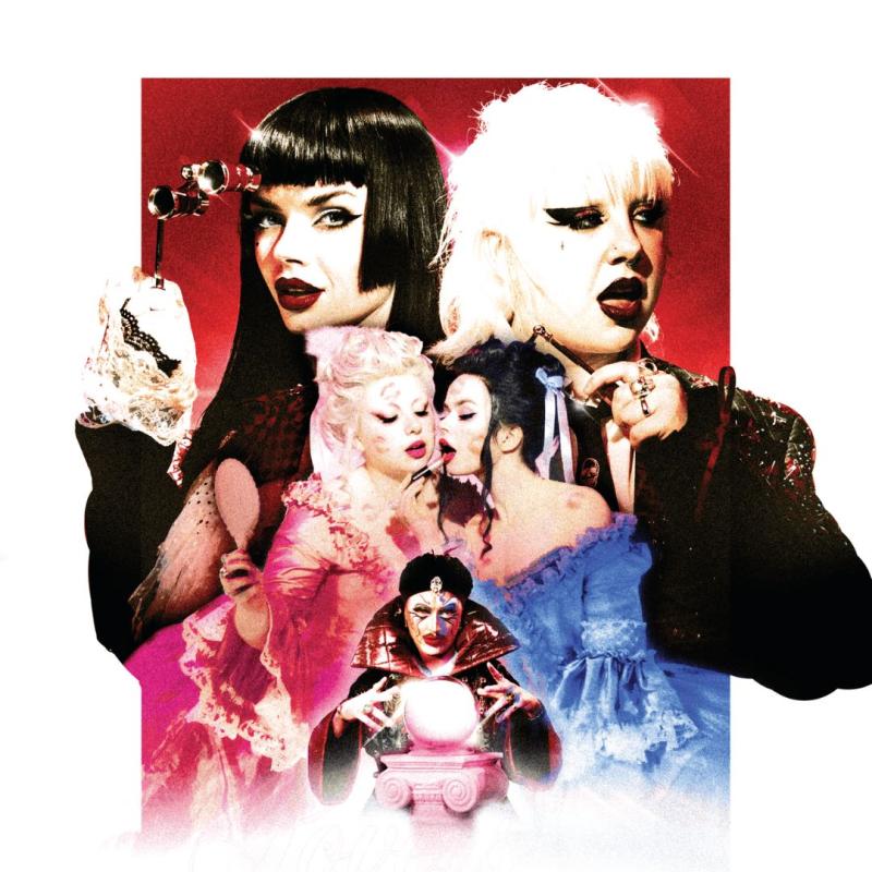 The performers are dressed in period costumes and dark eyeliner. At the front there is a fortune teller looking into a crystal ball.